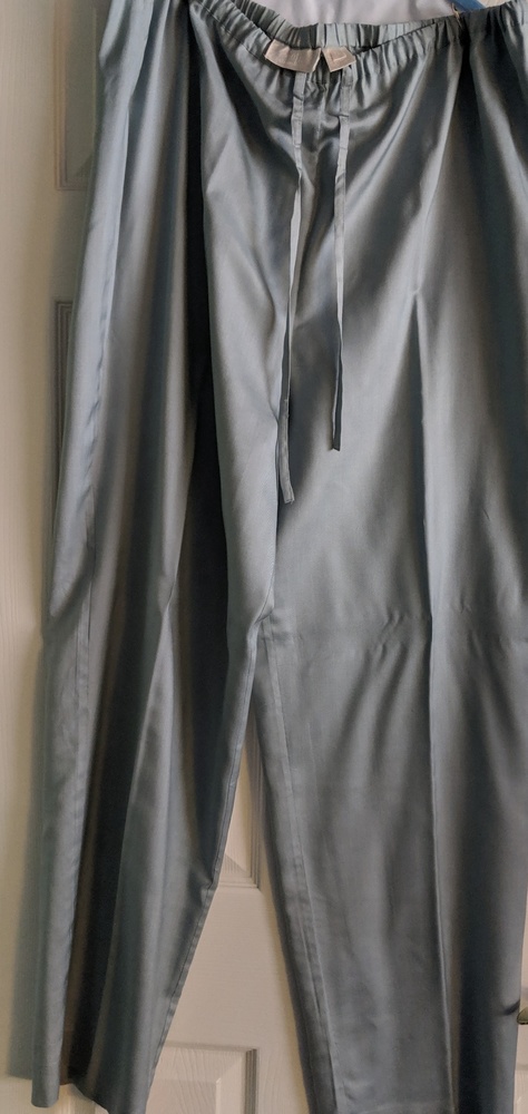 Light olive colored silk pants.